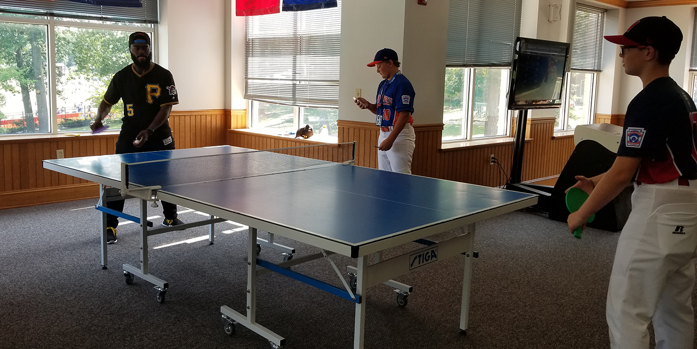 Harrison Playing Ping Pong with Players